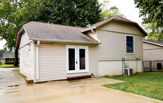 2008 Stanhope Road Springfield, IL 62702 - Photo 2 of 21 a view of a white house with a small yard and large parking space