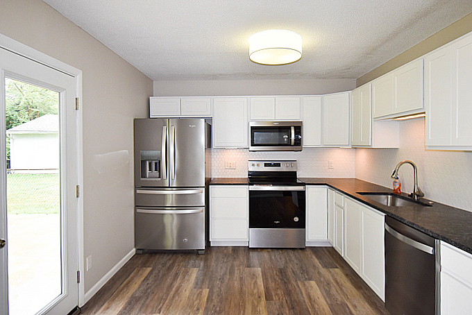 2008 Stanhope Road Springfield, IL 62702 - Photo 6 of 21 a kitchen with a refrigerator cabinets and wooden floor