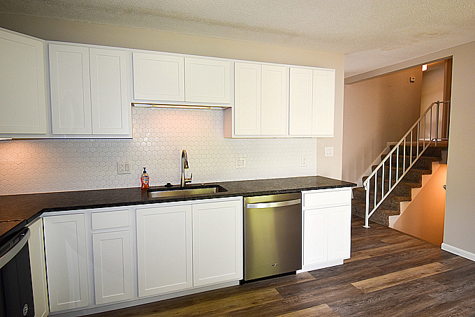 2008 Stanhope Road Springfield, IL 62702 - Photo 7 of 21 a kitchen with granite countertop white cabinets and a wooden floor