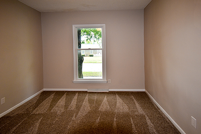 2008 Stanhope Road Springfield, IL 62702 - Photo 8 of 21 an empty room with wooden floor and a window