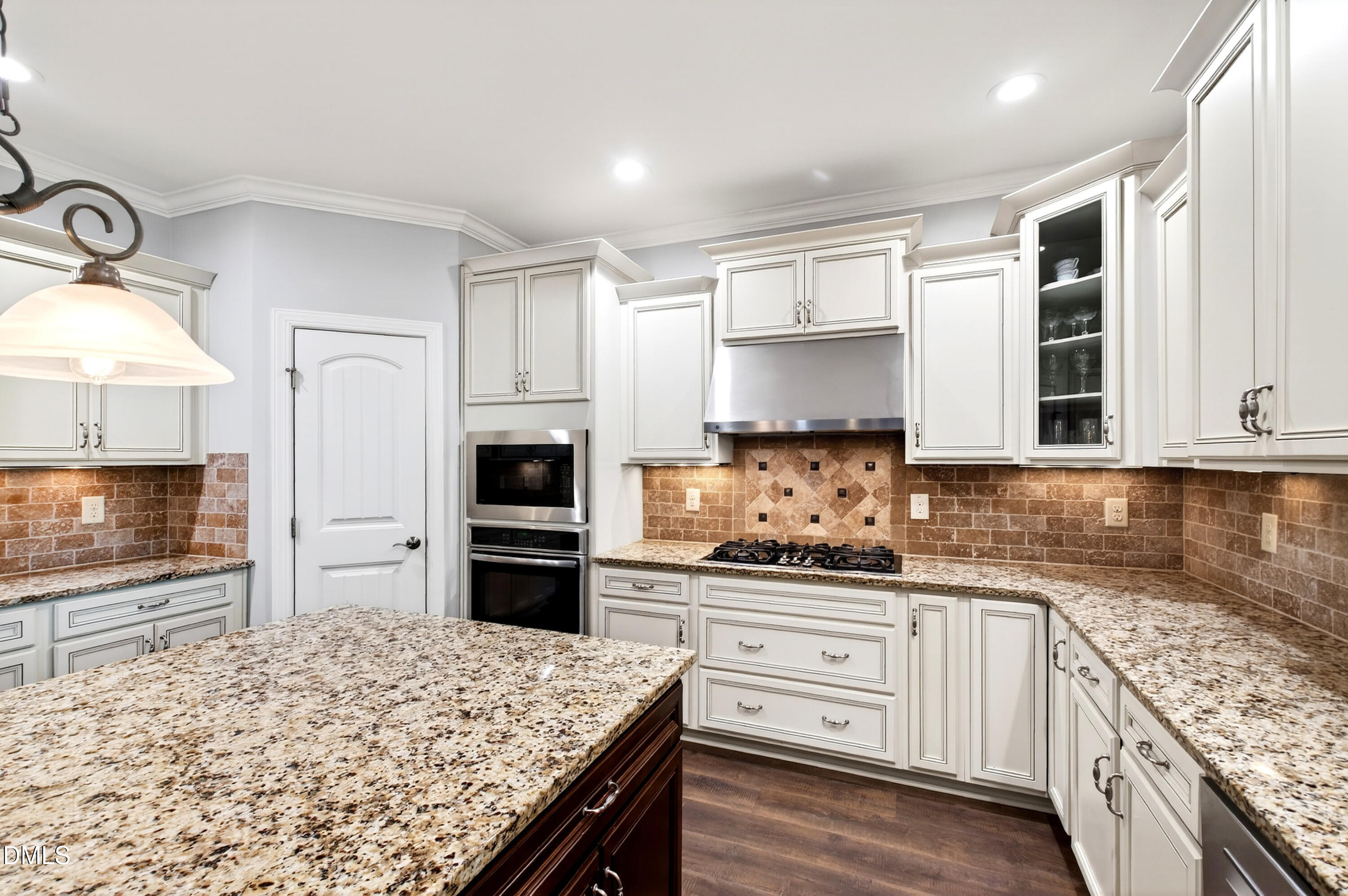 313 Karpen Lane Cary, NC 27519 - Photo 30 of 86 a kitchen with granite countertop a sink stove and refrigerator