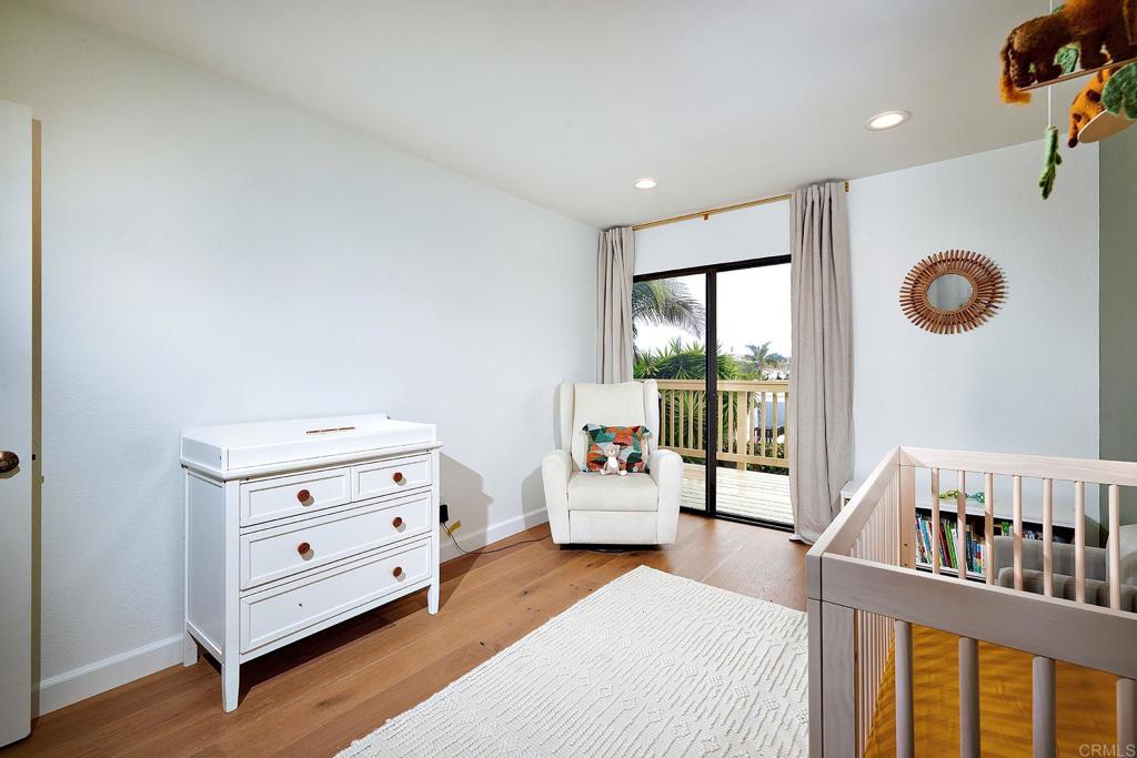 214 Calle De Madera Encinitas, CA 92024 - Photo 17 of 25 a bedroom with furniture and a window