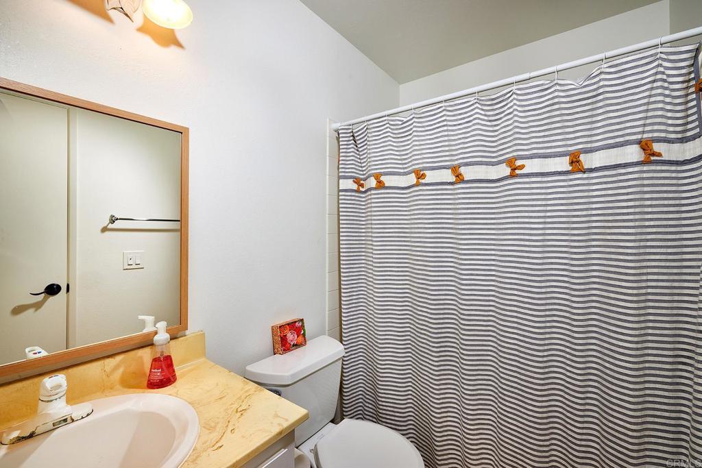 214 Calle De Madera Encinitas, CA 92024 - Photo 20 of 25 a bathroom with a sink and toilet