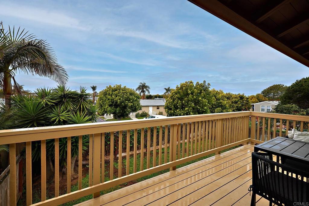 214 Calle De Madera Encinitas, CA 92024 - Photo 23 of 25 a view of balcony with wooden floor and fence