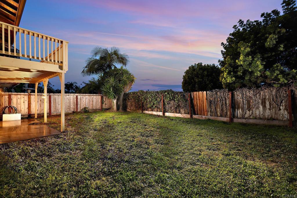 214 Calle De Madera Encinitas, CA 92024 - Photo 4 of 25 a backyard of a house with lots of green space