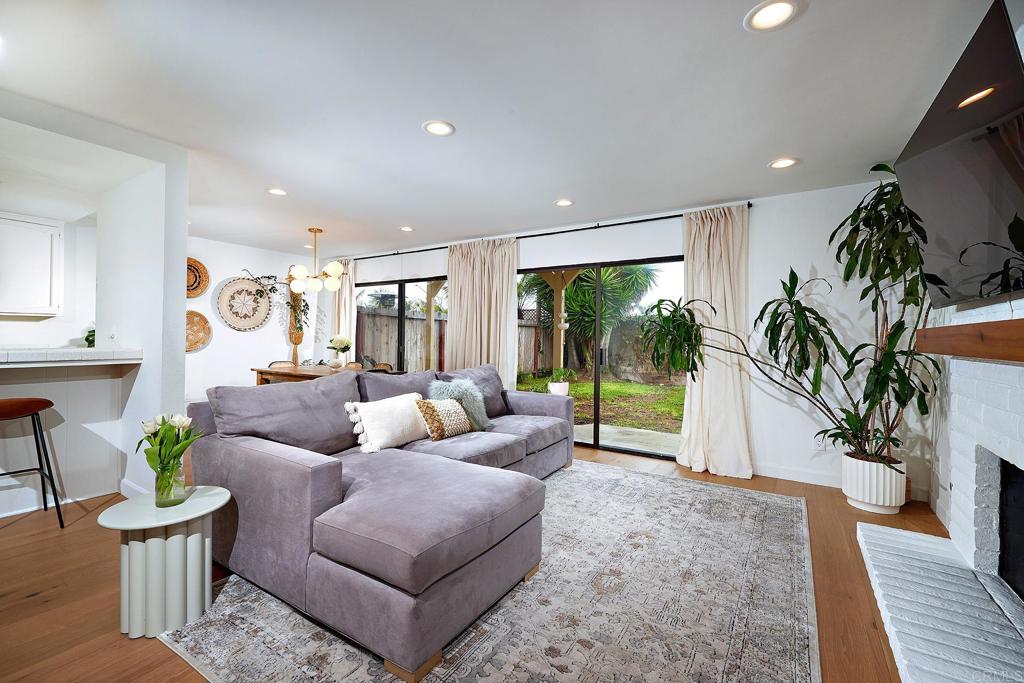 214 Calle De Madera Encinitas, CA 92024 - Photo 6 of 25 a living room with furniture and a large window