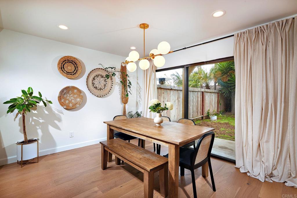 214 Calle De Madera Encinitas, CA 92024 - Photo 8 of 25 a view of a dining room with furniture window and wooden floor