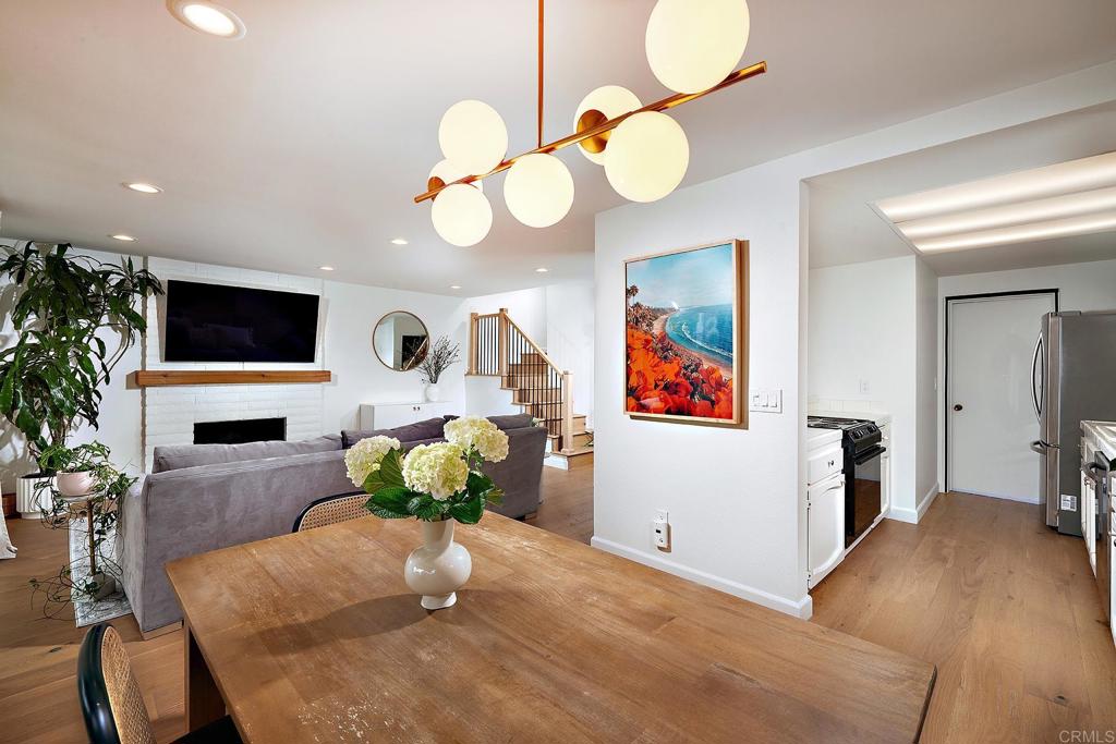 214 Calle De Madera Encinitas, CA 92024 - Photo 9 of 25 a living room with fireplace furniture and a flat screen tv