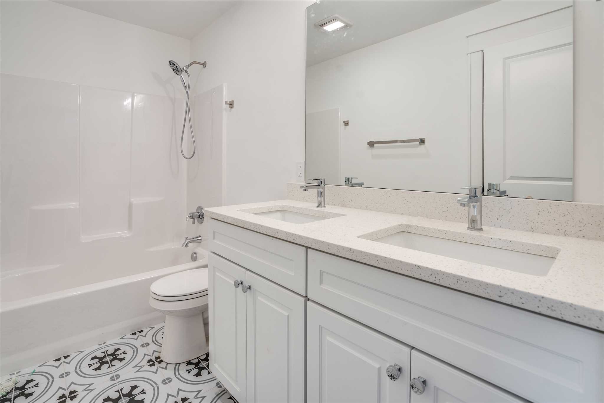 3 Cooper Road Fishkill, NY 12524 - Photo 24 of 26 a bathroom with a sink a toilet and a large mirror