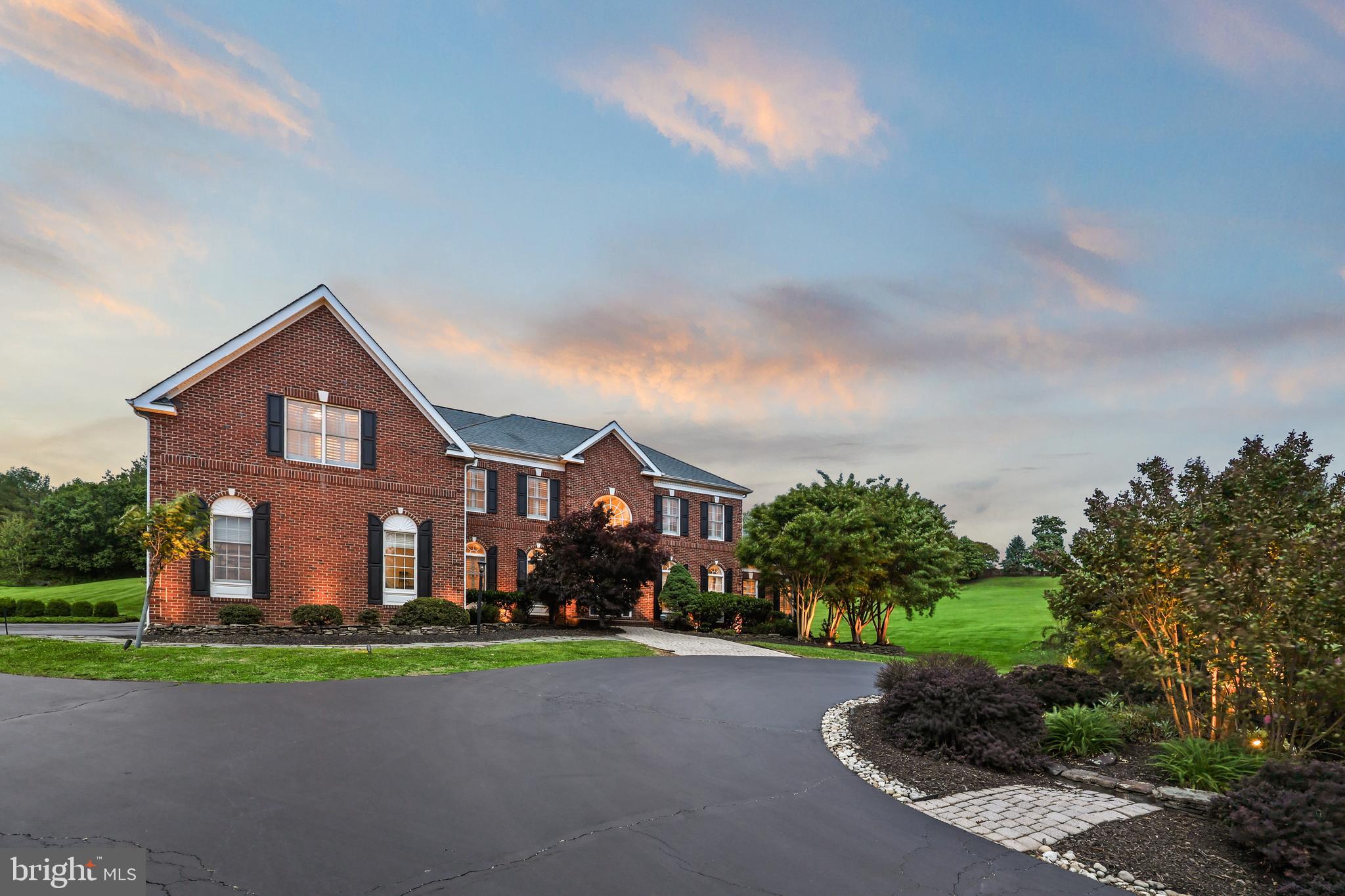 40890 Beechnut Road Leesburg, VA 20175 - Photo 4 of 65 a front view of a house with a yard and garage