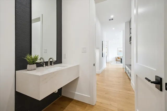 a bathroom with a sink and a mirror