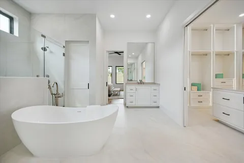 a bathroom with a bathtub and a shower