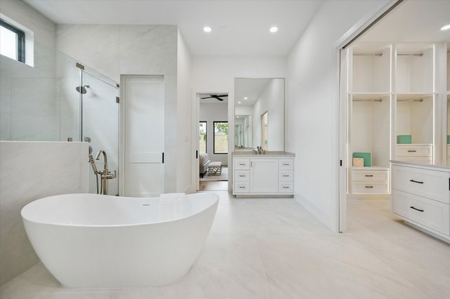 a bathroom with a bathtub and a shower