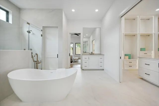a bathroom with a bathtub and a shower