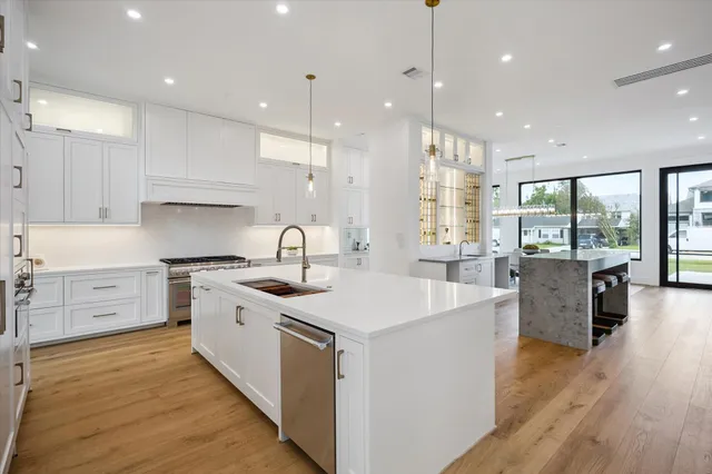 a large kitchen with stainless steel appliances kitchen island a large island in the center
