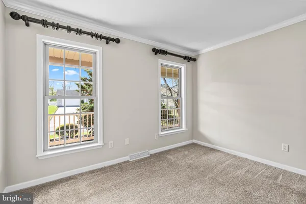 a view of an entryway with wooden floor and door