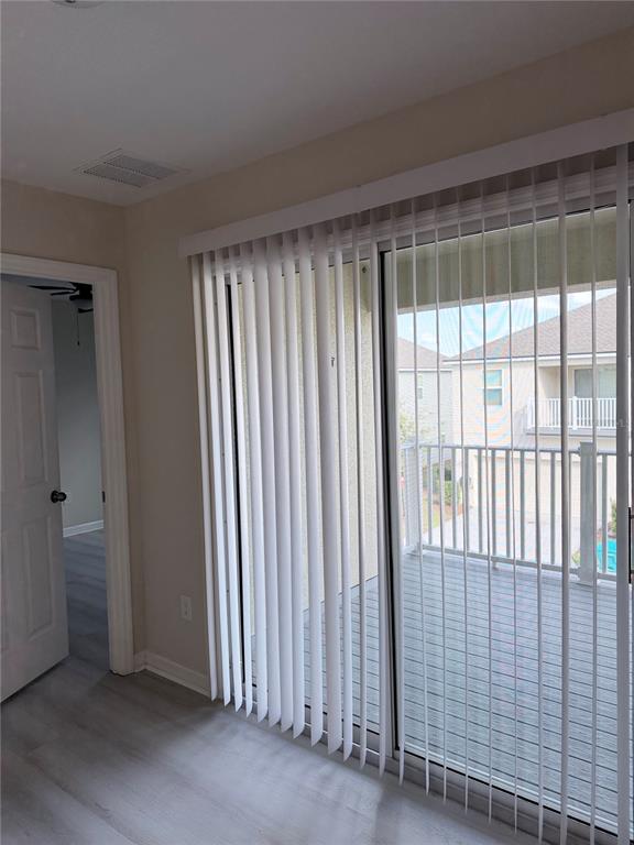 9463 Randal Park Boulevard Orlando, FL 32832 - Photo 12 of 25 a view of a balcony with wooden floor