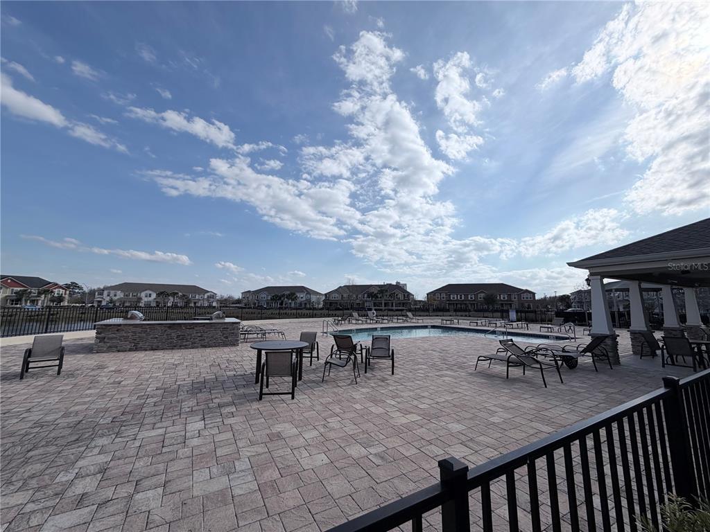 9463 Randal Park Boulevard Orlando, FL 32832 - Photo 25 of 25 a terrace with outdoor seating and city view