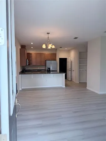 a view of a kitchen with a sink and a stove top oven
