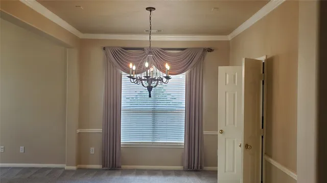 a backyard of a house with a garden and barbeque oven