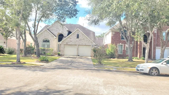 a view of a livingroom with wooden floor and windows
