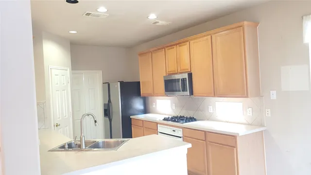 a view of a bathroom with a tub and shower
