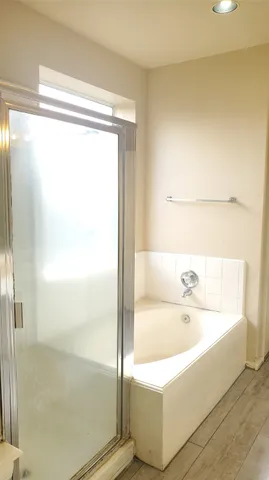 a view of a room with wooden floor