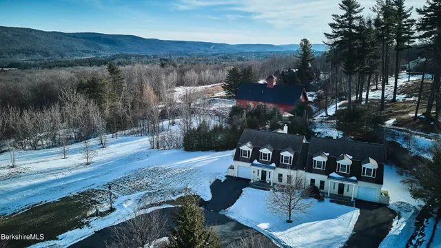 a view of a chairs and table in patio