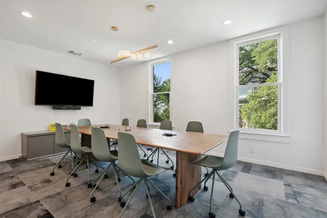 a view of a dining room with furniture window and outside view