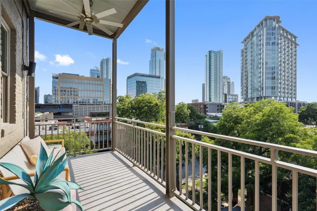 a view of balcony with a potted plant and outdoor seating