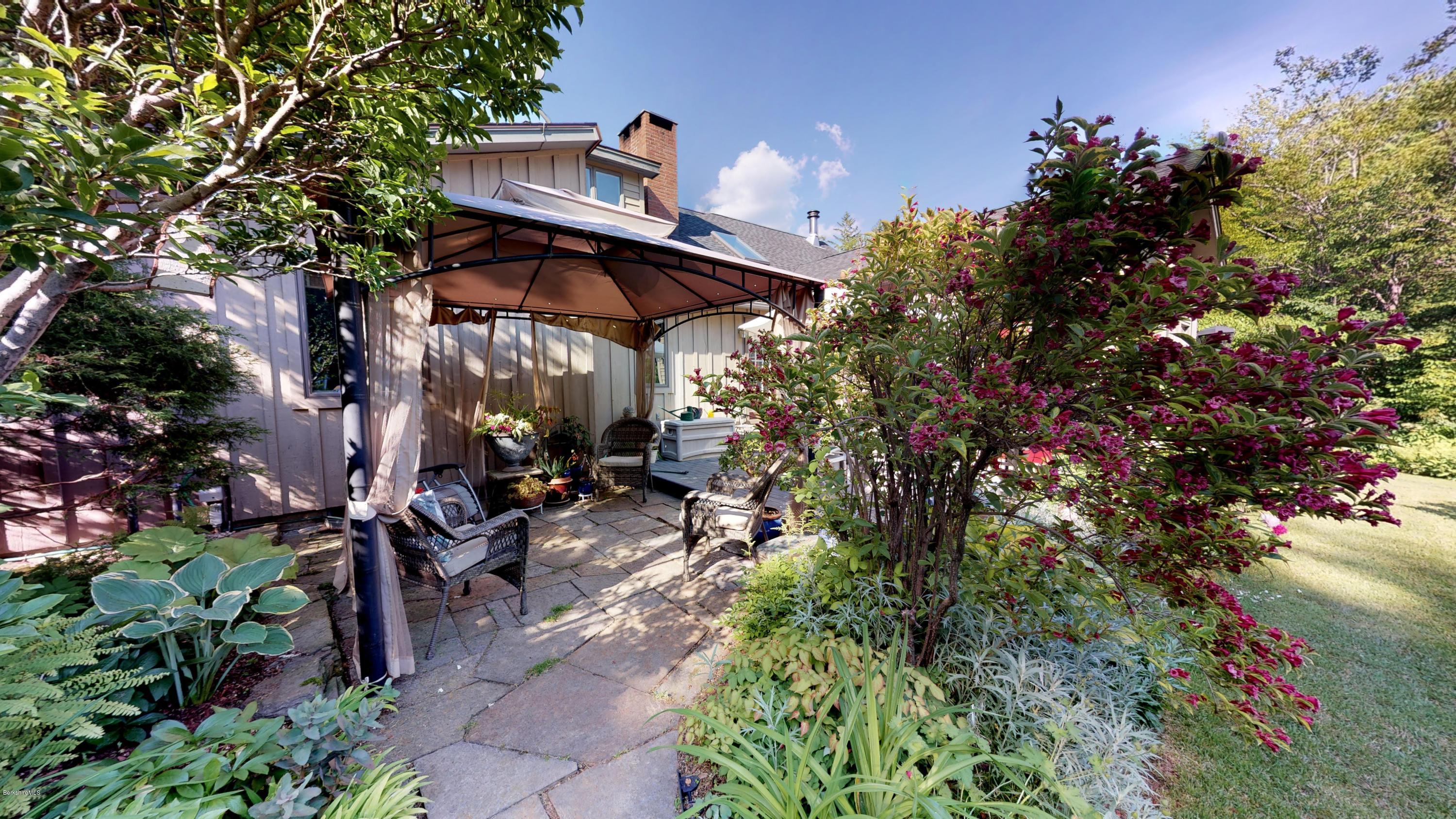 1016 High St Hill Road Windsor, MA 01270 - Photo 11 of 41 a view of a patio with table and chairs and potted plants
