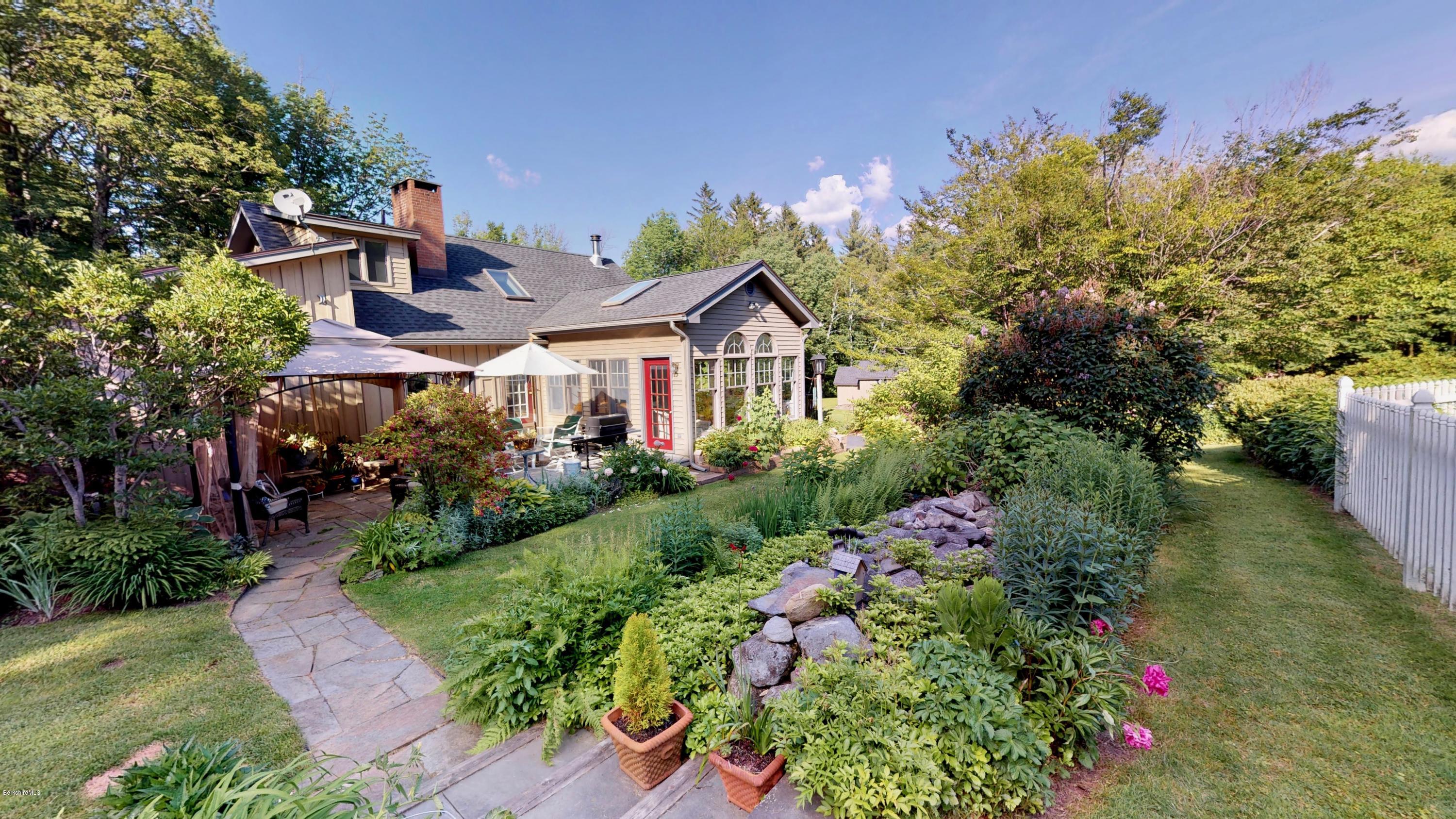 1016 High St Hill Road Windsor, MA 01270 - Photo 13 of 41 a front view of a house with a yard and fountain