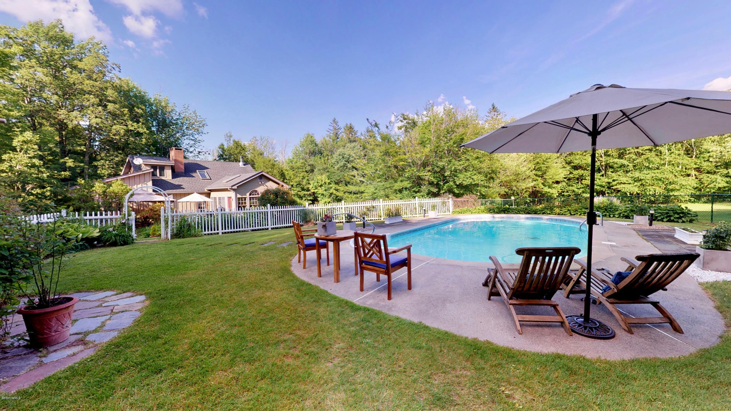 1016 High St Hill Road Windsor, MA 01270 - Photo 14 of 41 a view of a chairs and table in backyard of the house