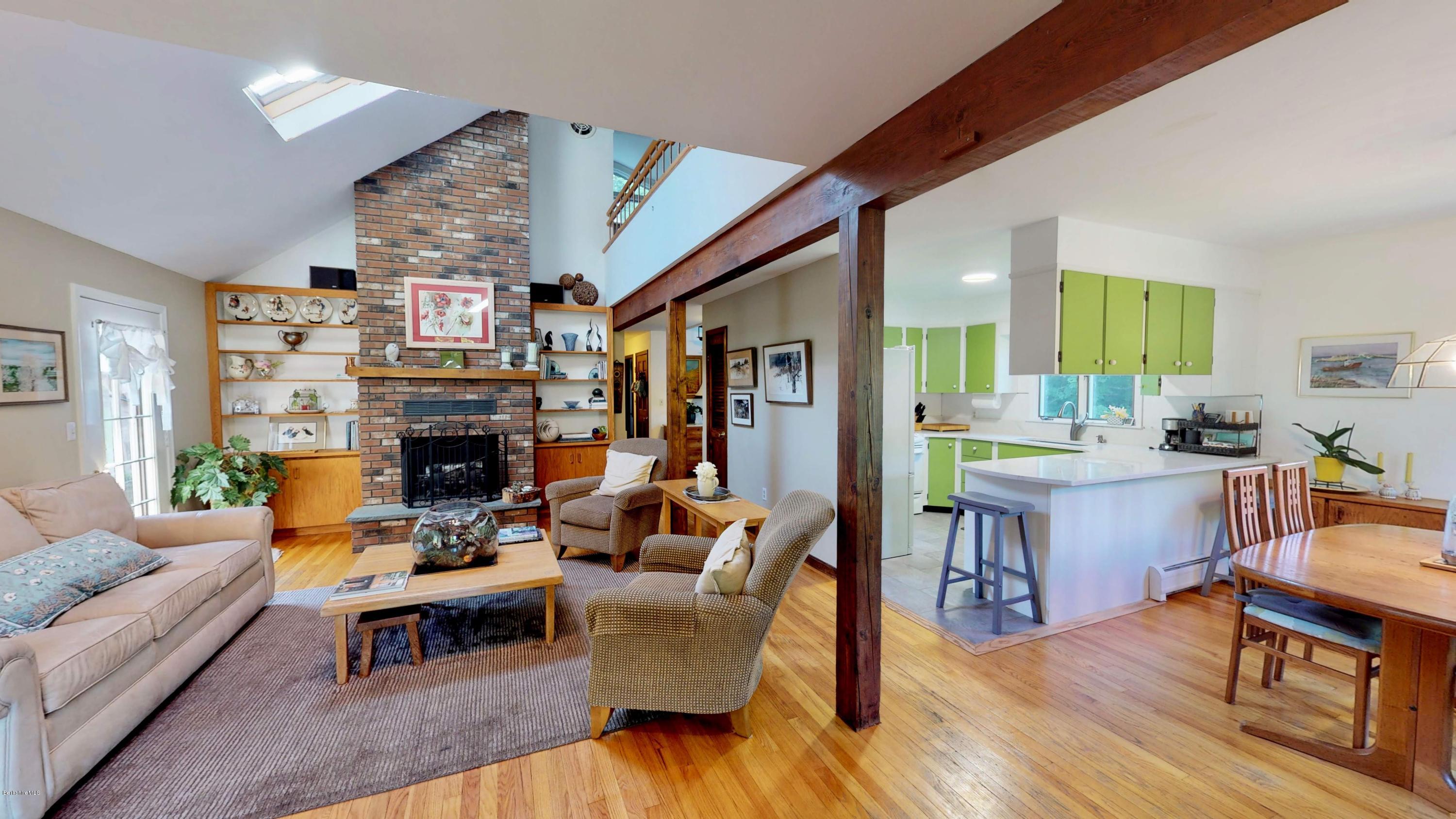 1016 High St Hill Road Windsor, MA 01270 - Photo 22 of 41 a living room with fireplace furniture and a wooden floor
