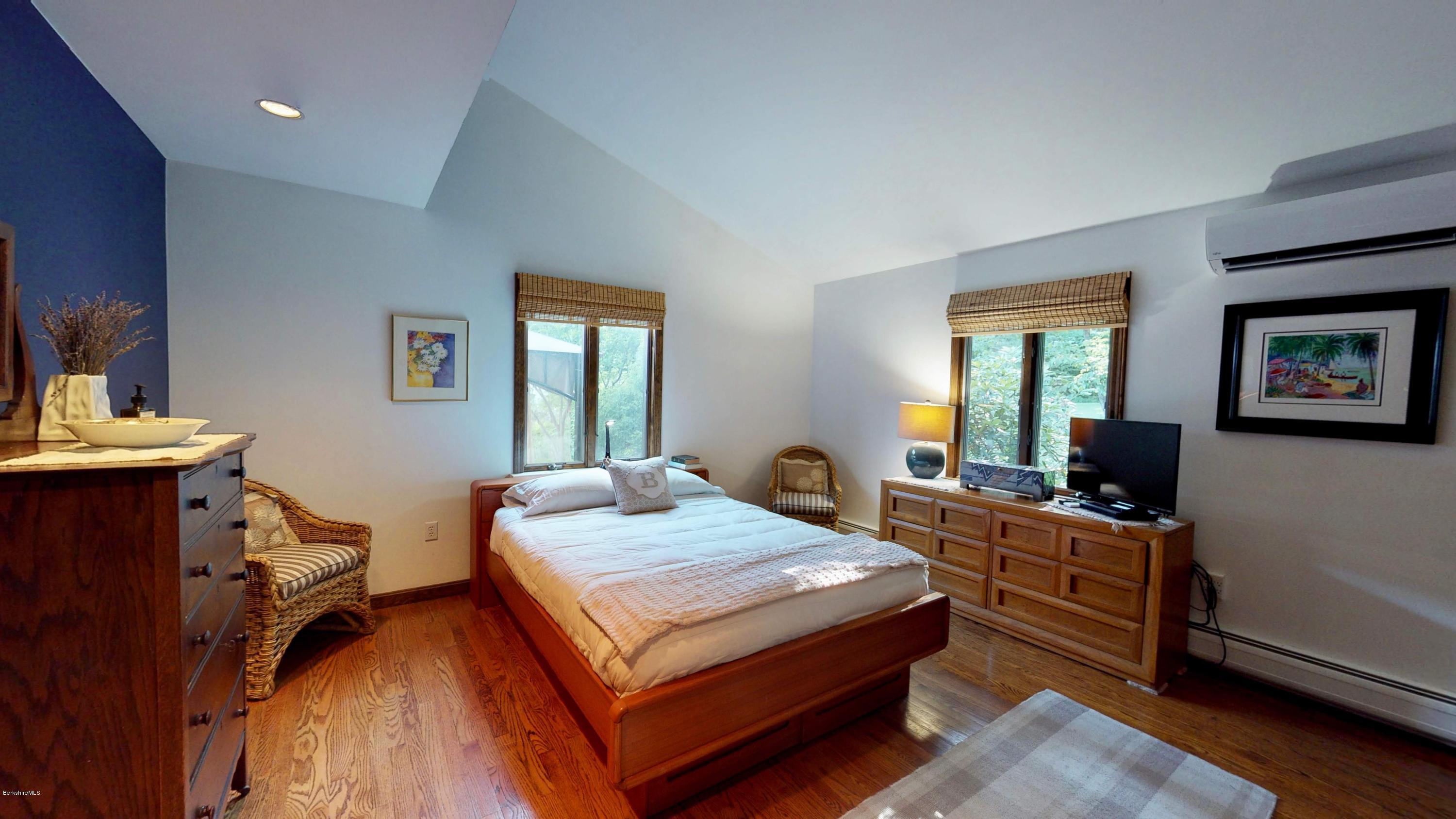 1016 High St Hill Road Windsor, MA 01270 - Photo 27 of 41 a bedroom with a bed and wooden floor