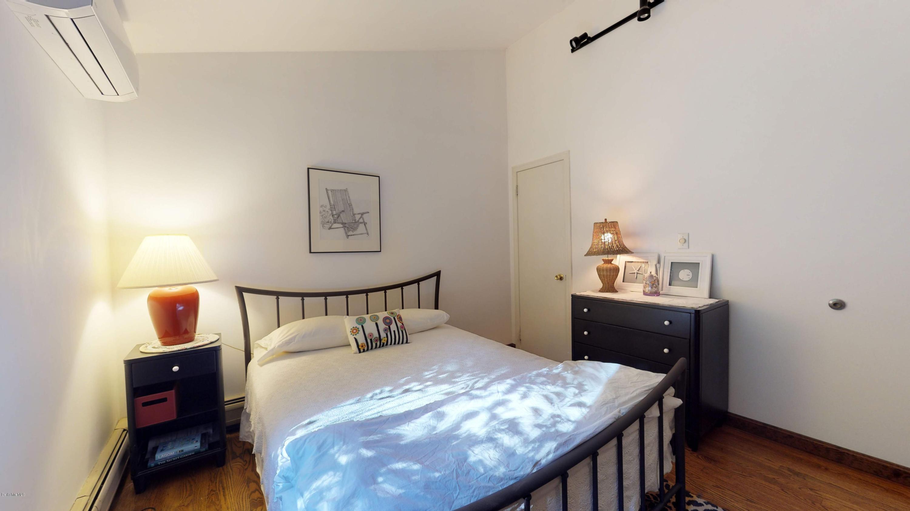 1016 High St Hill Road Windsor, MA 01270 - Photo 29 of 41 a bedroom with a bed and wooden floor