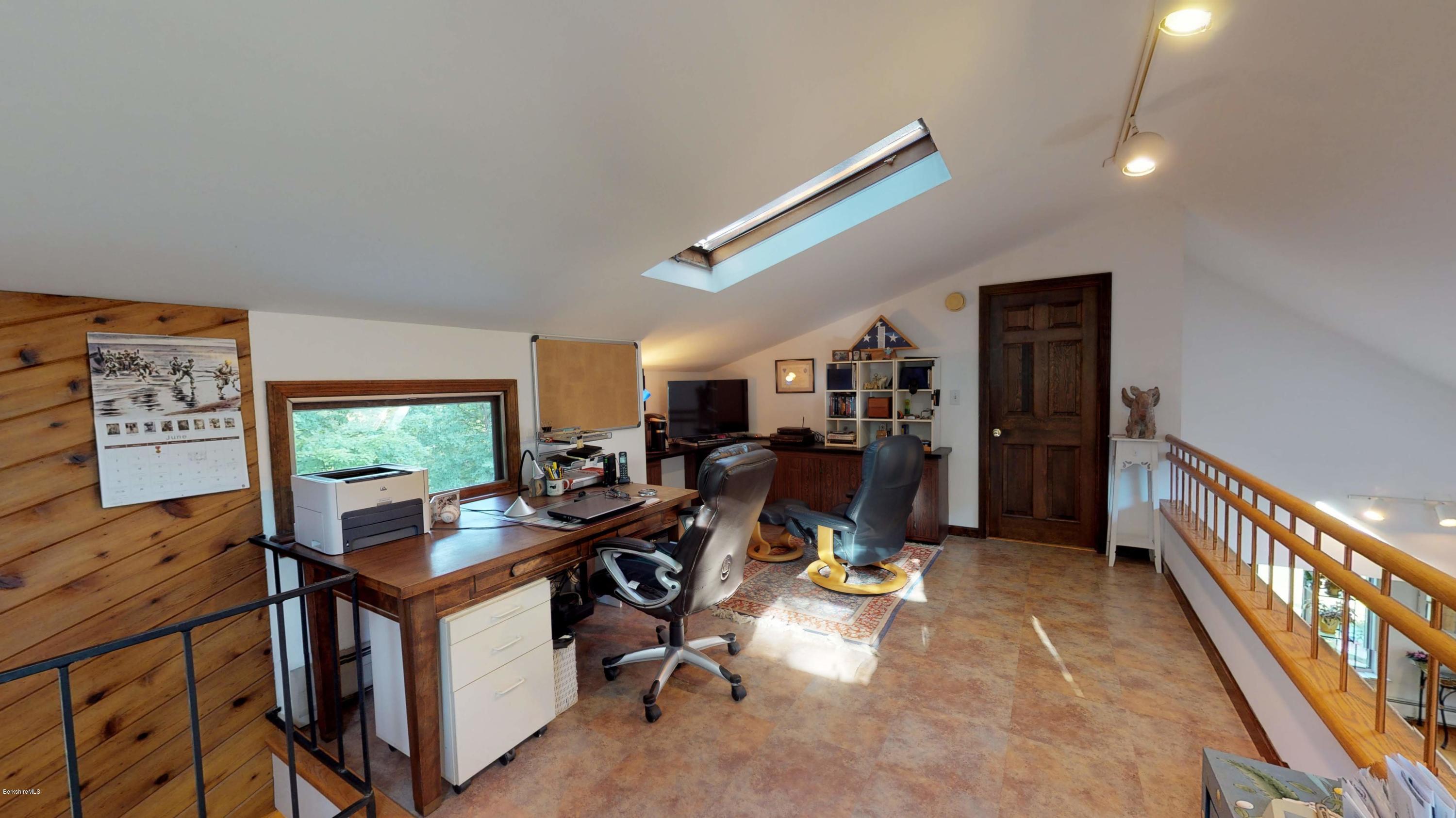 1016 High St Hill Road Windsor, MA 01270 - Photo 31 of 41 a view of a workspace with furniture and a window