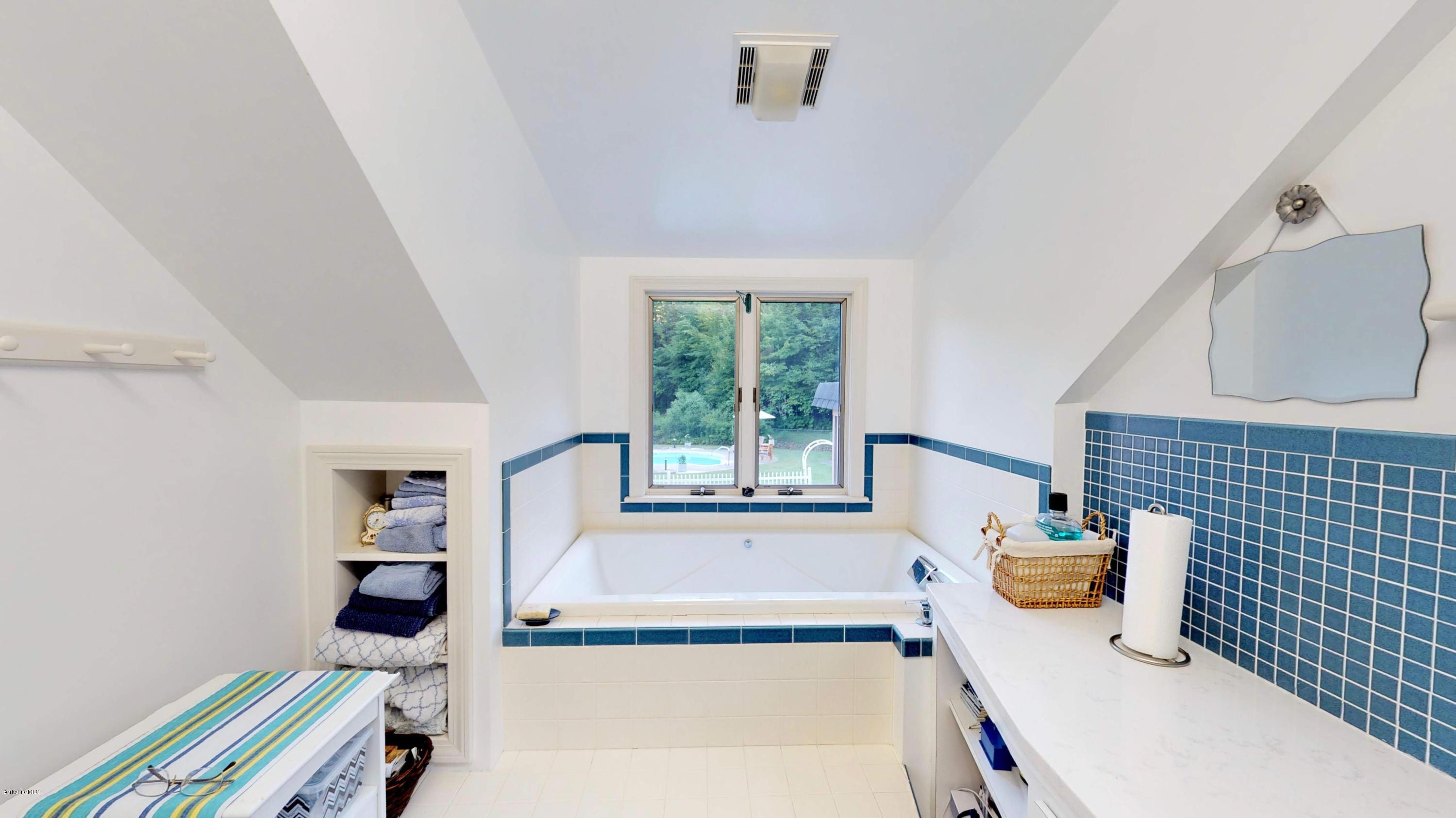 1016 High St Hill Road Windsor, MA 01270 - Photo 34 of 41 a bathroom with a tub and a window