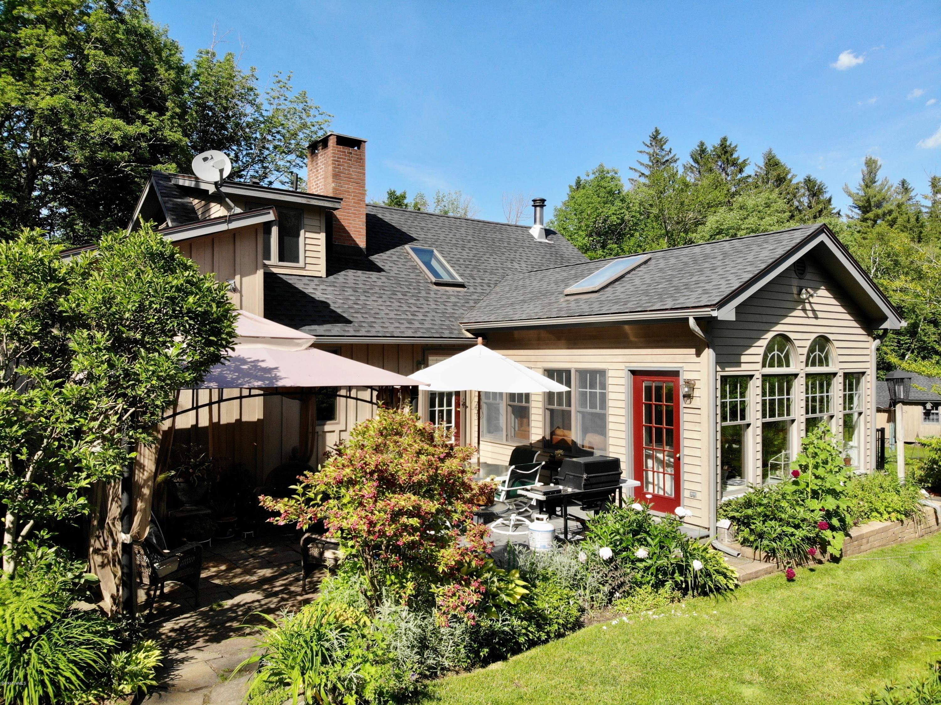 1016 High St Hill Road Windsor, MA 01270 - Photo 5 of 41 a front view of a house with garden