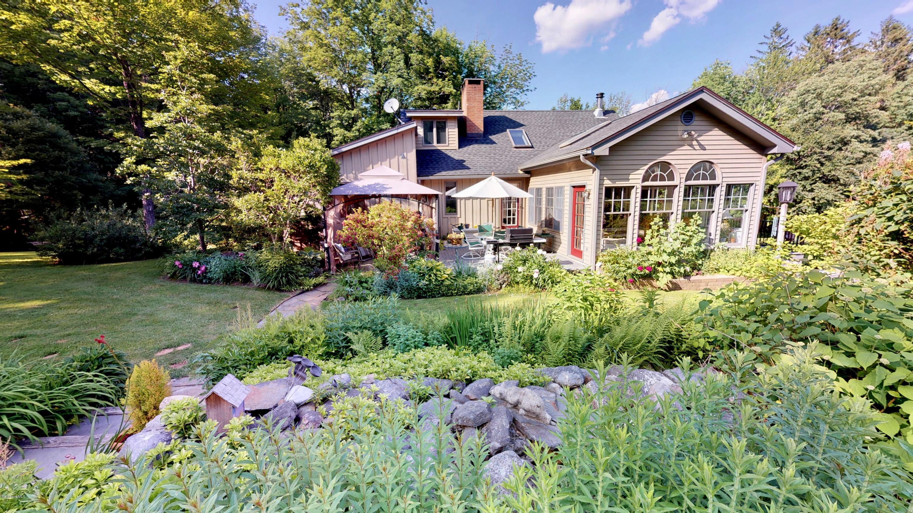 1016 High St Hill Road Windsor, MA 01270 - Photo 6 of 41 a front view of a house with garden