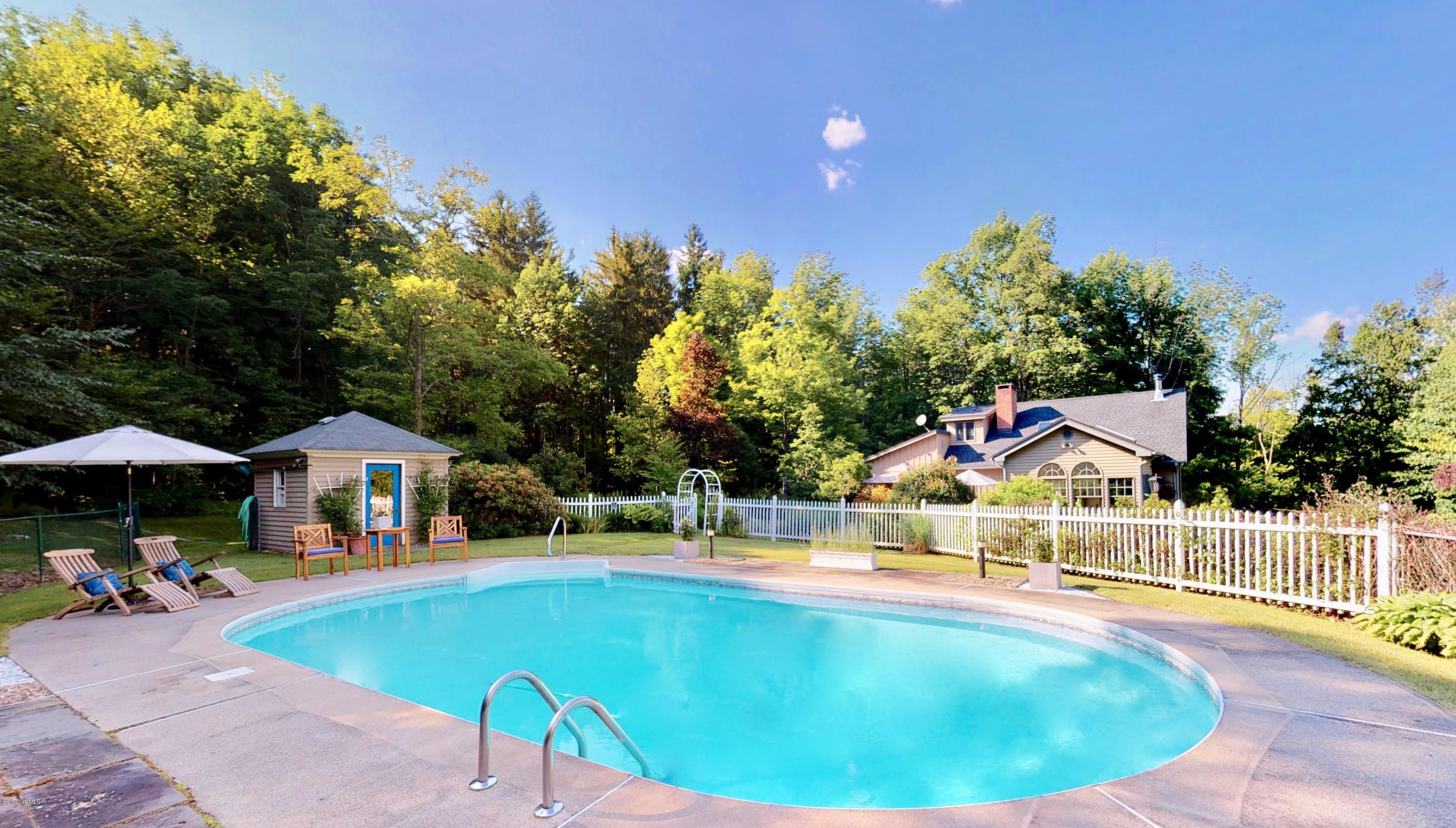 1016 High St Hill Road Windsor, MA 01270 - Photo 9 of 41 a view of swimming pool with seating area and trees in the background