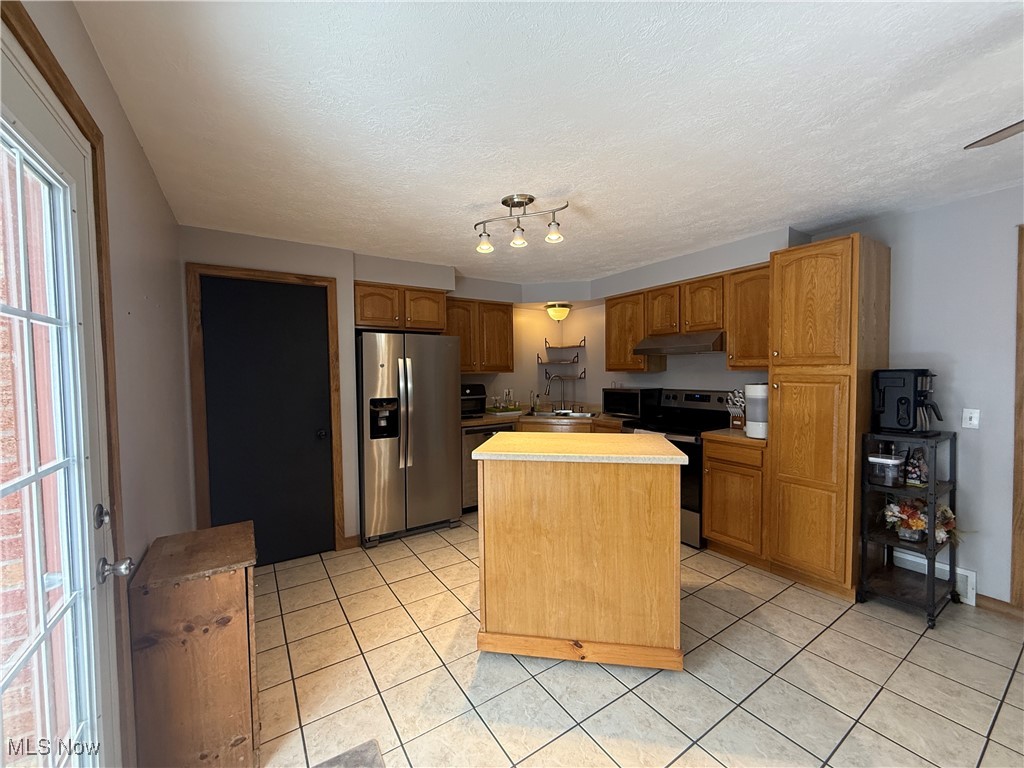 26017 Hartley Road Beloit, OH 44609 - Photo 7 of 28 Kitchen with sink, and an island