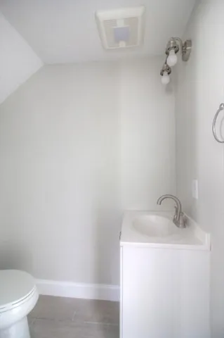 a bathroom with a sink and toilet