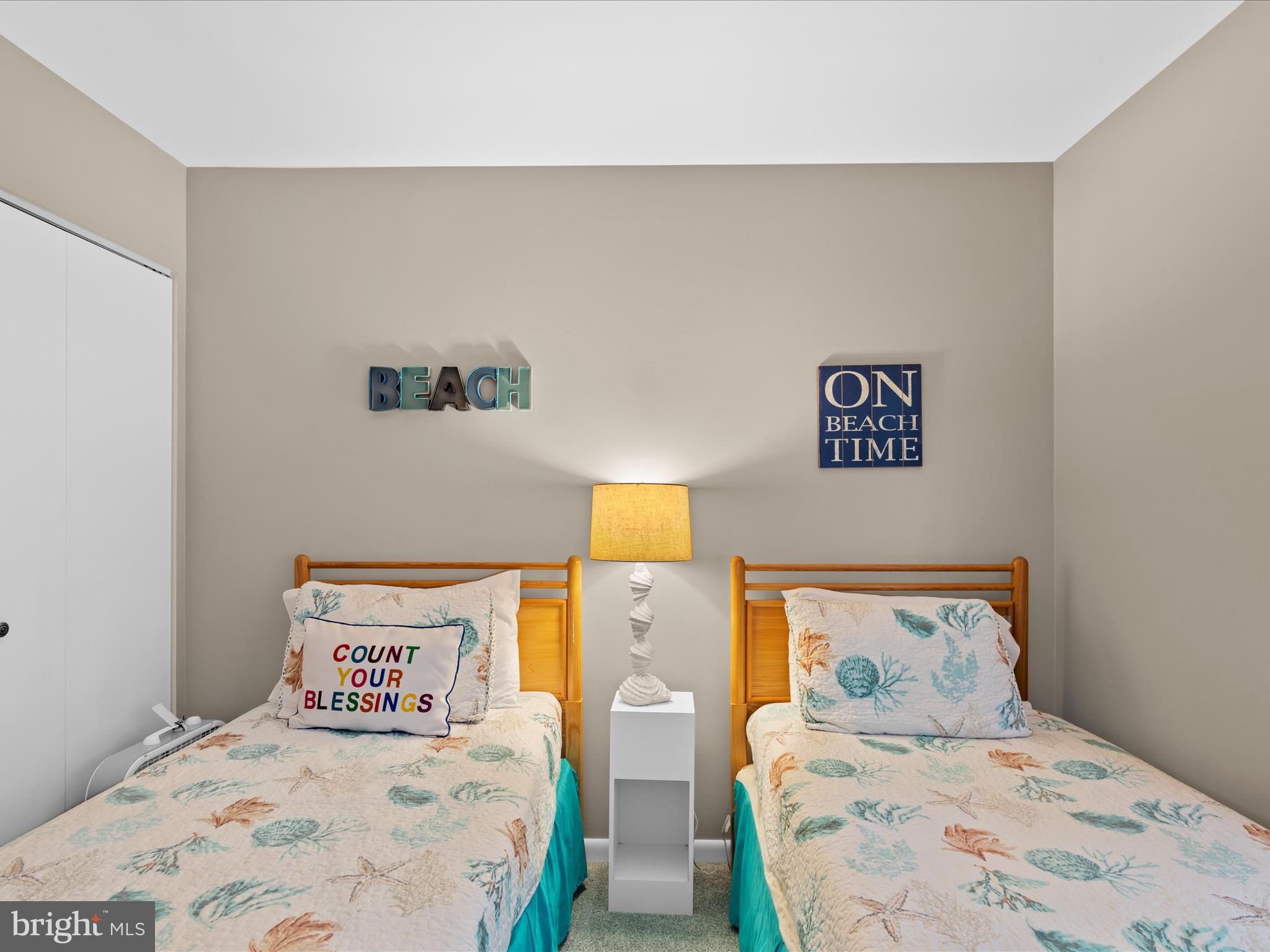 39346 Racquet Lane, Unit 8504 Bethany Beach, DE 19930 - Photo 21 of 40 a bedroom with two bed and painting on the wall