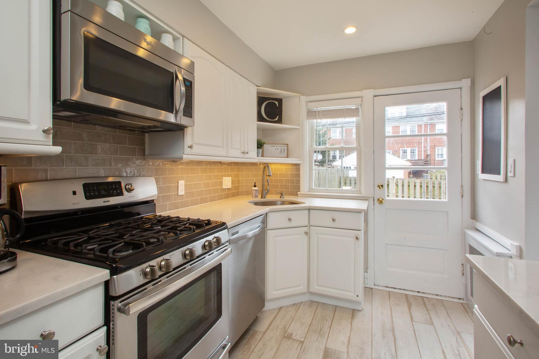 103 Murdock Road Baltimore, MD 21212 - Photo 13 of 41 Marble-quartz counters. Recessed & UC lites.