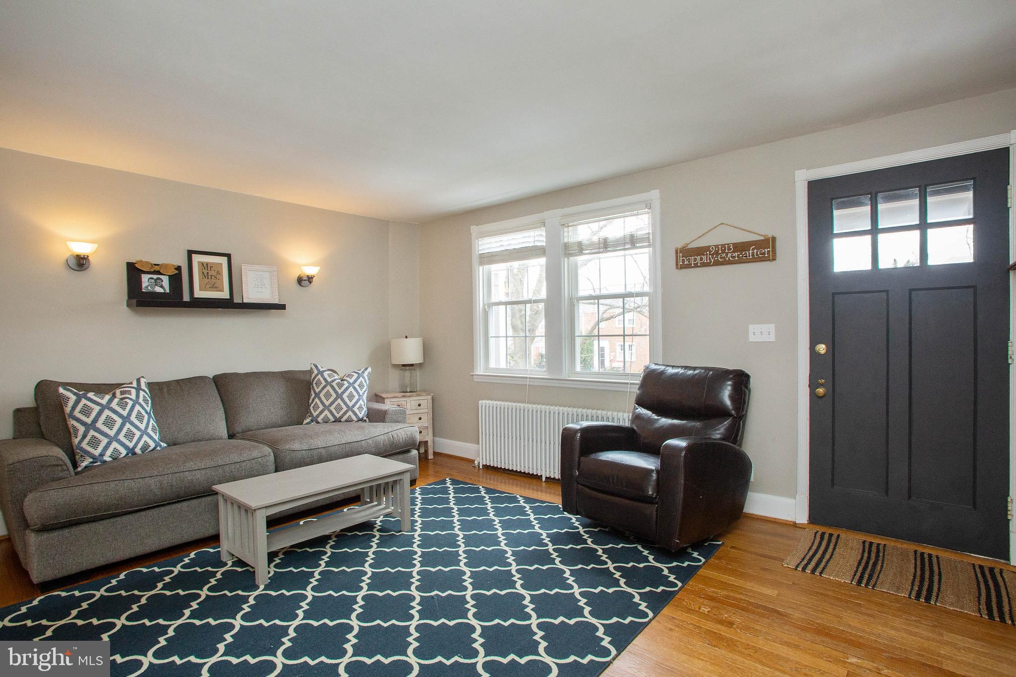 103 Murdock Road Baltimore, MD 21212 - Photo 6 of 41 Living Room with natural wood entry door.