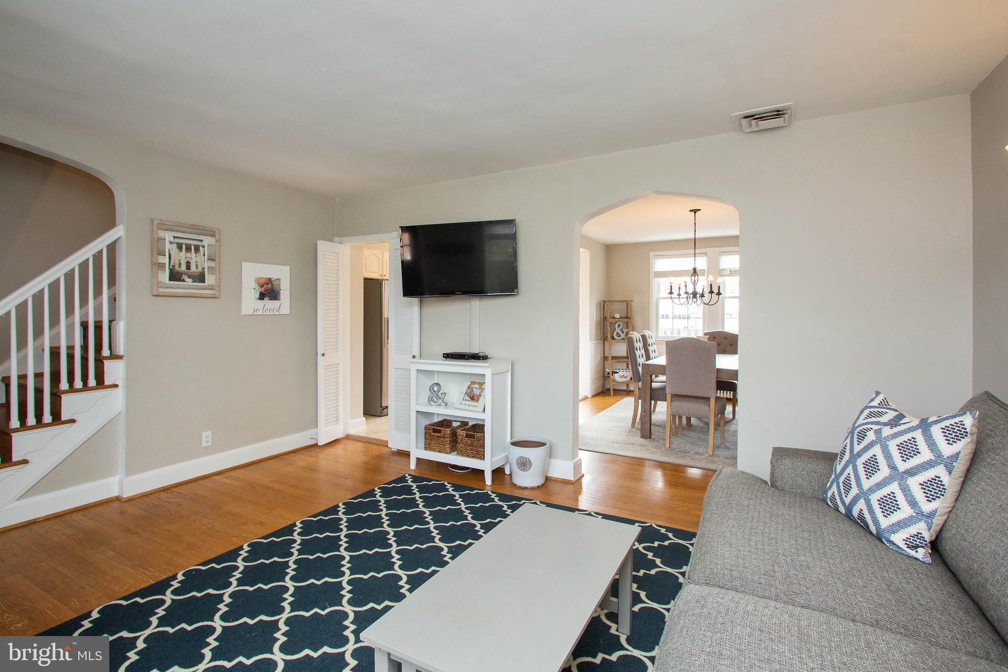 103 Murdock Road Baltimore, MD 21212 - Photo 7 of 41 Living Room flows to Kitchen & Dining areas.
