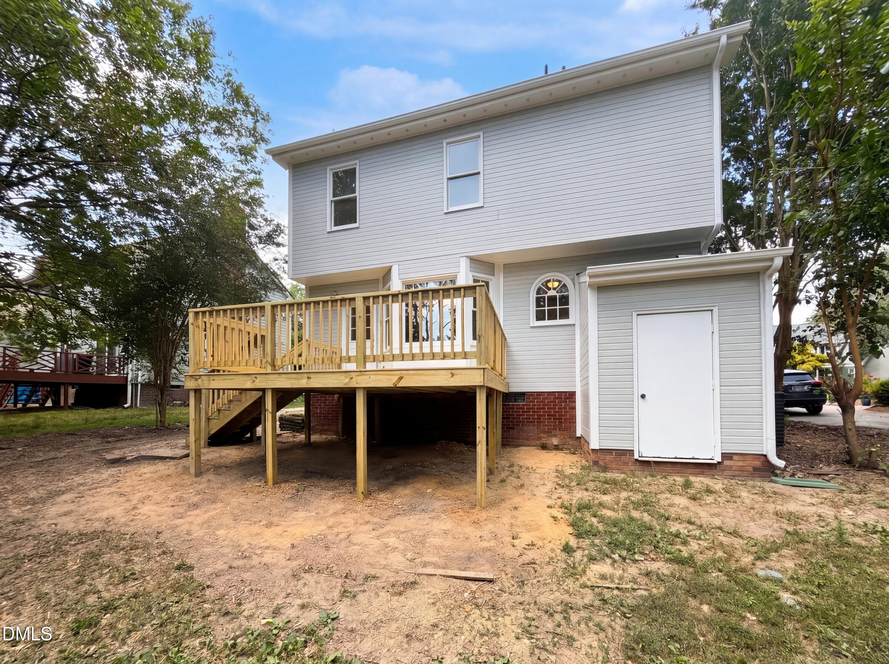 3921 Iron Horse Road Raleigh, NC 27616 - Photo 15 of 20 a front view of a house with a yard and garage