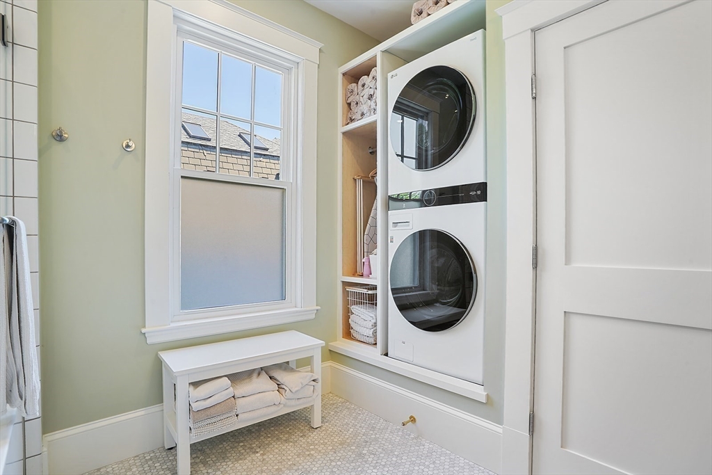 89 Upland Road, Unit 2 Cambridge, MA 02140 - Photo 13 of 17 a view of a kitchen with washer and dryer
