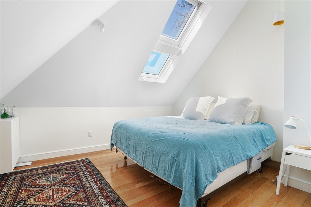89 Upland Road, Unit 2 Cambridge, MA 02140 - Photo 14 of 17 a bedroom with a bed and a window